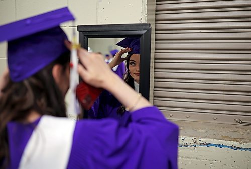 25062024
Graduate Summer Sheppard-Jackson adjusts her mortarboard in a mirror prior to Vincent Massey High School&#x2019;s 2024 Convocation at the Keystone Centre on Tuesday.
(Tim Smith/The Brandon Sun)