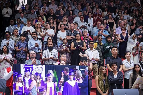 25062024
Family, friends and other supporters stand as graduates enter Westoba Place for Vincent Massey High School&#x2019;s 2024 Convocation at the Keystone Centre on Tuesday.
(Tim Smith/The Brandon Sun)