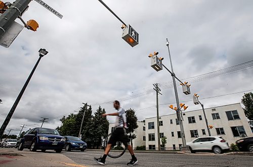 JOHN WOODS / FREE PRESS
People use a new crosswalk at St Mary and Carrier Monday, June 24, 2024. The city has added lights and time at several crosswalks.

Reporter: joyanne