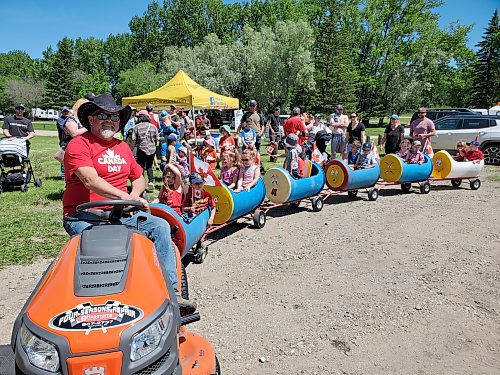 Ken Labelle drives the Kids Train at Minnedosa Campground and Beach on Canada Day. (Miranda Leybourne/The Brandon Sun)