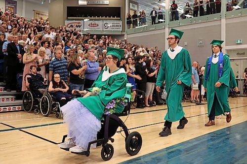 Graduates enter the Brandon University Healthy Living Centre during the processional for École secondaire Neelin High School’s 2024 convocation on Wednesday. (Tim Smith/The Brandon Sun)