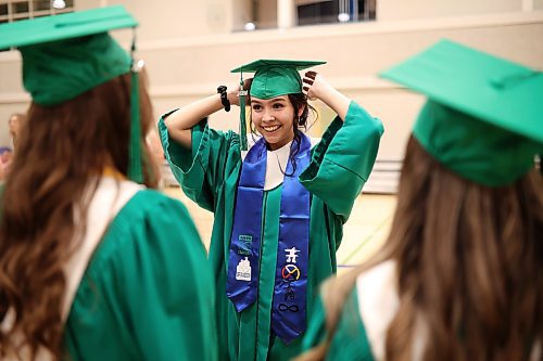 Graduate Georgia Keller adjusts her mortarboard while getting ready for the processional on Wednesday. (Tim Smith/The Brandon Sun)