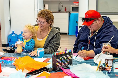 NIC ADAM / FREE PRESS
(From left) Tucker and Shawn Obedzinski and Tristan Nicolas at the Stroke survivors in the Stroke Recovery Association of Manitoba&#x2019;s art class making tissue paper art on Wednesday morning.
240626 - Wednesday, June 26, 2024.

Reporter: Thandi