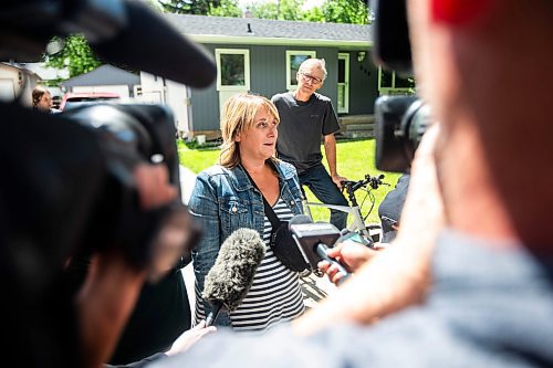 MIKAELA MACKENZIE / FREE PRESS

Neighbour Brandi Nevis speaks to the media at the scene of a house explosion on Camrose Bay in Transcona on Wednesday, June 26, 2024.

For Malak story.

