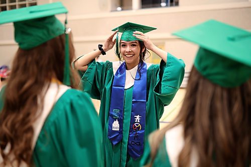 26062024
Graduate Georgia Keller adjusts her mortarboard while geting ready for the processional during &#xc9;cole secondaire Neelin High School&#x2019;s 2024 Convocation at the Brandon University Healthy Living Centre on Wednesday.
(Tim Smith/The Brandon Sun)