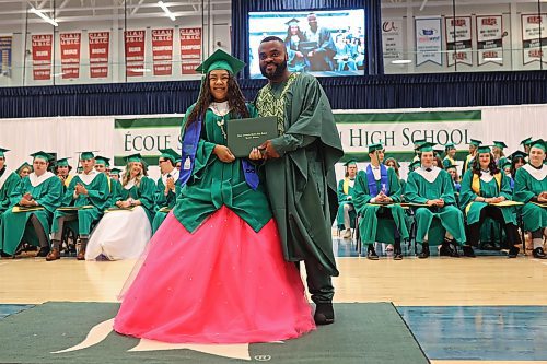 26062024
Graduate Brytanna Linklater Zachary smiles while receiving her diploma from principal Baseswa Nundu during &#xc9;cole secondaire Neelin High School&#x2019;s 2024 Convocation at the Brandon University Healthy Living Centre on Wednesday.
(Tim Smith/The Brandon Sun)