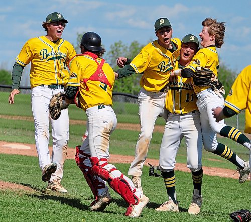 Tyler Robertson, left, and the Boissevain Broncos celebrate winning high school provincials. (Jules Xavier/The Brandon Sun)