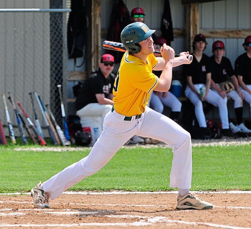 Broncos first baseman Tyler Robertson watches his hit sail over the Reston center fielder's glove during a high school game in Boissevain. (Jules Xavier/The Brandon Sun)