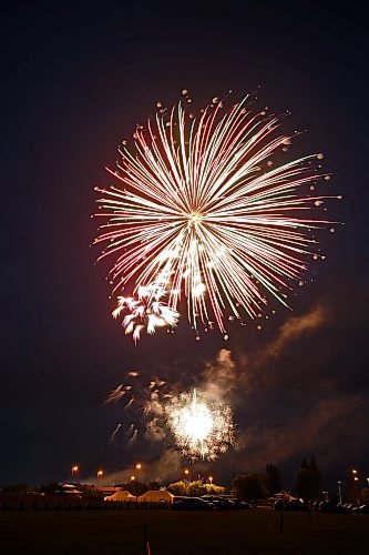 A fireball of green, red and white lights up the sky over the Riverbank Discovery Centre on Saturday night, as fireworks mark the end to Canada Day 2023. (Matt Goerzen/The Brandon Sun)