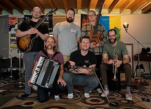 JESSICA LEE / WINNIPEG FREE PRESS

Winnipeg Ukrainian folk-punk fusion band Zrada pose for a photo at one of the members&#x2019; basement/rehearsal room on November 23, 2022. From left to right (top row): Adam Ciric, Nick Luchak, Alex Derlago, (bottom row) Andrijko Semaniuk, Mikhas Chabluk and Andriy Michalchyshyn.

Reporter: Melissa Martin