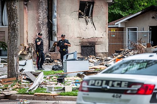 MIKAELA MACKENZIE / FREE PRESS

Police survey the rubble where a house exploded yesterday on Camrose Bay in Transcona on Thursday, June 27, 2024.

For &#x2014; story.

