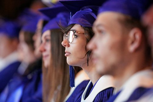 Light from the stage is reflected in the glasses of one of 45 students from Prairie Hope High School during their graduation ceremony on Thursday. (Matt Goerzen/The Brandon Sun)