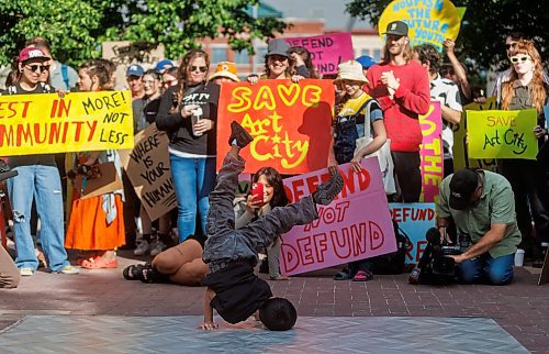 MIKE DEAL / FREE PRESS
Silas Comia, 7, dances for the crowd gathered at City Hall to protest a proposed 62% cut to the Community Grants fund which would be catastrophic for organizations like Graffiti Gallery which has a Youth Olympic Program preparing kids for the Breakdancing category in 2026 Summer Youth Olympics in Dakar, Senegal.

Supporters of community organizations like ArtCity and Graffiti Gallery rally at City Hall in an effort to reverse a proposed 62% cut to the Community Grants fund.  This is a $2.1 million cut from a $3.4 million budget.
240627 - Thursday, June 27, 2024.