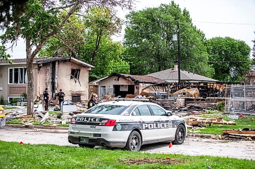 MIKAELA MACKENZIE / FREE PRESS

Police survey the rubble where a house exploded yesterday on Camrose Bay in Transcona on Thursday, June 27, 2024.

For &#x2014; story.

