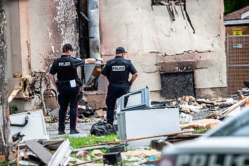 MIKAELA MACKENZIE / FREE PRESS

Police survey the rubble where a house exploded yesterday on Camrose Bay in Transcona on Thursday, June 27, 2024.

For &#x2014; story.

