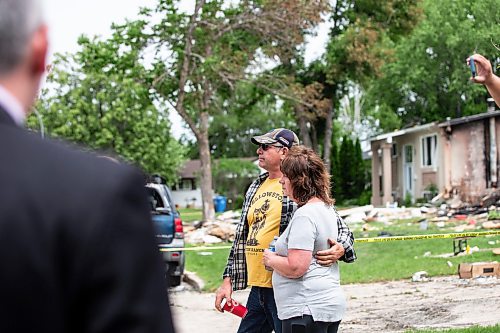 MIKAELA MACKENZIE / FREE PRESS

Neighbours Ray and Mary Ann Lariviere listen to a press conference in front the rubble where a house exploded yesterday on Camrose Bay in Transcona on Thursday, June 27, 2024.

For &#x460;story.

