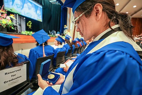 Ruth Bonneville / Free Press

Standup. - RB Russell Graduation pics

R.B. Russell grade 12 High School student, Brayden Marsden looks at his Governor General's Award medal after receiving it while attending his graduation Commencement Ceremony with fellow students at the school Thursday. 





June 27tth, 2024