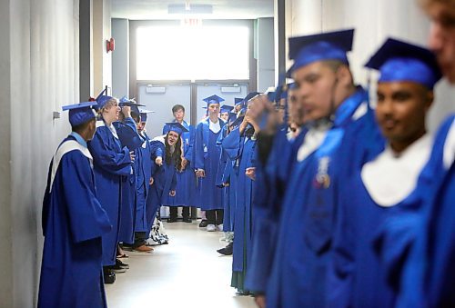 Students with Prairie Hope High School line up in the hallway outside the changing rooms at the Western Manitoba Centennial Auditorium a few minutes before walking on stage for their graduation ceremony on Thursday afternoon. (Matt Goerzen/The Brandon Sun)