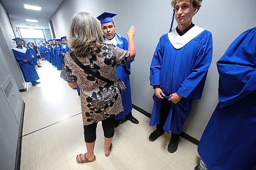 Students with Prairie Hope High School get last minute instructions while lined up in the hallway outside the changing rooms at the Western Manitoba Centennial Auditorium a few minutes before walking on stage for their graduation ceremony on Thursday afternoon. (Matt Goerzen/The Brandon Sun)