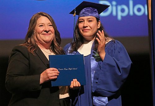 Fighting back tears, Prairie Hope High School student Ashley Happyjack Pompana accepts her graduation diploma from school principal Katherine MacFarlane on Thursday afternoon at the Western Manitoba Centennial Auditorium. (Matt Goerzen/The Brandon Sun)