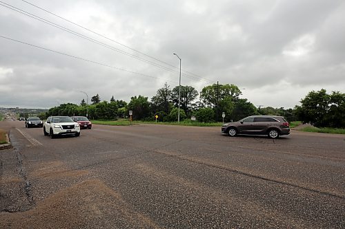 Cars pass through the intersection of 18th Street North and Braecrest Drive on Friday afternoon. A planned housing development on the southwestern corner of the intersection has been cancelled, which means developers will no longer be giving a portion of the property to the city so that a long-awaited roundabout can be built there. (Colin Slark/The Brandon Sun)