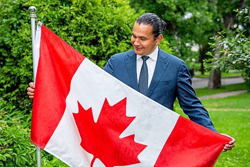 NIC ADAM / FREE PRESS
Premier Wab Kinew outside his house with the Canadian flag he purchased and installed after his trip to Normandy.
240628 - Friday, June 28, 2024.

Reporter: Carole Sanders