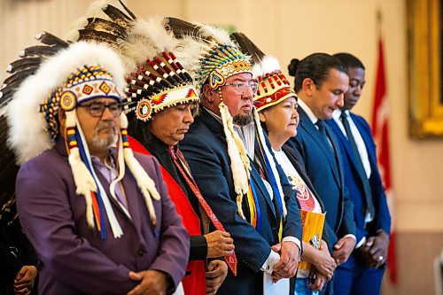 MIKAELA MACKENZIE / FREE PRESS

Minegoziibe Anishinaabe chief Derek Nepinak (centre), other chiefs, and provincial politicians stand for a drum song during a signing ceremony between three First Nations and the province of Manitoba at the Manitoba Legislative Building on Friday, June 28, 2024.

For Martin Cash story.

