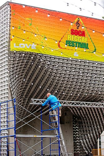 MIKAELA MACKENZIE / FREE PRESS

Michael Lysohirka, sound tech for the Soca Reggae Festival, sets up the stage at Old Market Square in the rain on Friday, June 28, 2024. The performances for Friday night were moved indoors, but the weekend is expected to go as planned.

Standup.

