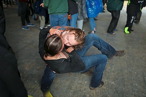 28062024
Halle Dupre and Bryce Dubek of Arborg, Manitoba kiss while dancing to the music of Quinton Blair during Dauphin&#x2019;s Countryfest on a wet Friday afternoon. (Tim Smith/The Brandon Sun)