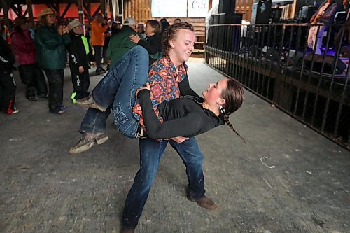 28062024
Bryce Dubek and Halle Dupre of Arborg, Manitoba dance to the music of Quinton Blair during Dauphin&#x2019;s Countryfest on a wet Friday afternoon. (Tim Smith/The Brandon Sun)