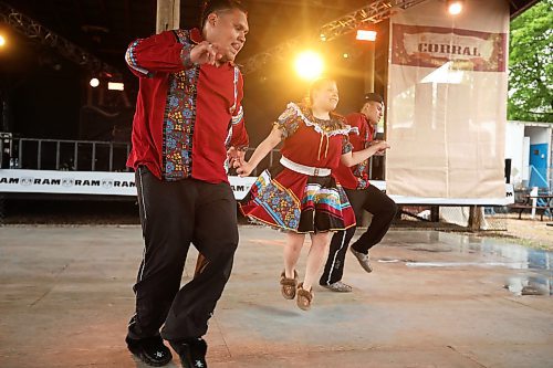 28062024
Siblings Mikey Harris, Cieanna Harris and Jacob Harris, known collectively as the Ivan Flett Memorial Dancers, perform during Dauphin&#x2019;s Countryfest on a wet Friday afternoon. (Tim Smith/The Brandon Sun)