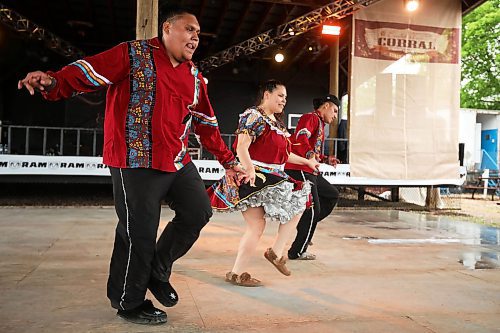 28062024
Siblings Mikey Harris, Cieanna Harris and Jacob Harris, known collectively as the Ivan Flett Memorial Dancers, perform during Dauphin&#x2019;s Countryfest on a wet Friday afternoon. (Tim Smith/The Brandon Sun)