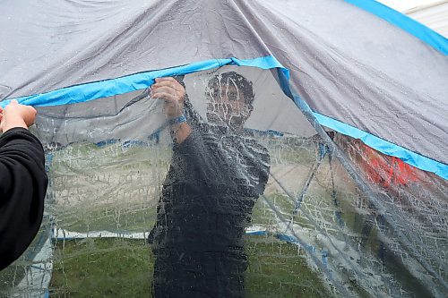 28062024
Festival-goers set up camp during pouring rain at Dauphin&#x2019;s Countryfest on Friday afternoon. (Tim Smith/The Brandon Sun)