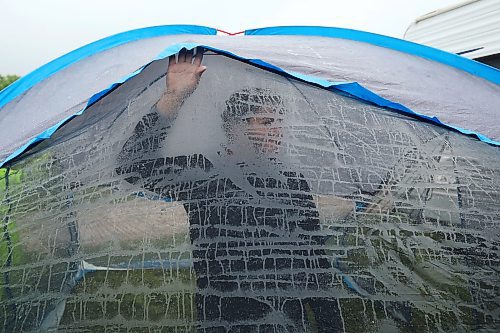 28062024
Festival-goers set up camp during pouring rain at Dauphin&#x2019;s Countryfest on Friday afternoon. (Tim Smith/The Brandon Sun)