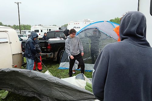 28062024
Festival-goers set up camp during pouring rain at Dauphin&#x2019;s Countryfest on Friday afternoon. (Tim Smith/The Brandon Sun)