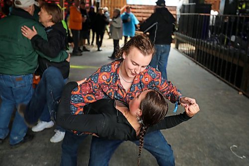 28062024
Bryce Dubek and Halle Dupre of Arborg, Manitoba dance to the music of Quinton Blair during Dauphin&#x2019;s Countryfest on a wet Friday afternoon. (Tim Smith/The Brandon Sun)