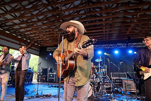 28062024
Quinton Blair and his band perform during Dauphin&#x2019;s Countryfest on a wet Friday afternoon. (Tim Smith/The Brandon Sun)