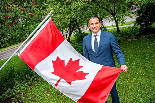 NIC ADAM / FREE PRESS
Premier Wab Kinew outside his house with the Canadian flag he purchased and installed after his trip to Normandy.
240628 - Friday, June 28, 2024.

Reporter: Carole Sanders