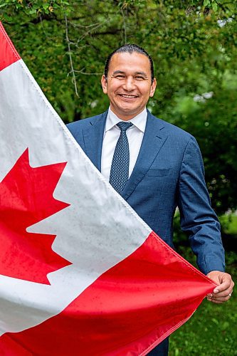 NIC ADAM / FREE PRESS
Premier Wab Kinew outside his house with the Canadian flag he purchased and installed after his trip to Normandy.
240628 - Friday, June 28, 2024.

Reporter: Carole Sanders