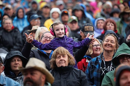 A young girl dances to the music of The Great Canadian Roadtrip featuring Doc Walker, Michelle Wright and Jason McCoy during the mainstage lineup at Dauphin’s Countryfest on Friday evening. Despite its wet start, the festival was seeing high attendance numbers yesterday, organizers said. See story on Page A4. (Tim Smith/The Brandon Sun)