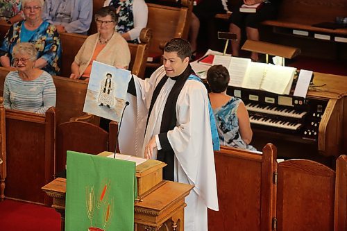 Archdeacon Jonathan Hoskin said during his service at St. Paul's United Church in Souris on Sunday that after joking that no one got him a Father's Day gift at a previous service, someone made a macaroni portrait of him. (Colin Slark/The Brandon Sun)