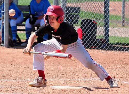 Xavier Hall with the 13U AAA Okotoks Dawgs Academy laid down the perfect slap bunt to move runners over, and made it safely to first base during his team's 16-0 win over the Brandon Marlins on Day 2 of the Canada Day Triple Crown Showdown at Simplot Park. With the win and 4-0 record, Okotoks finished first overall. (Jules Xavier/The Brandon Sun)