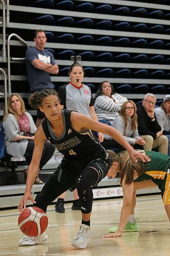 Manitoba's Madeleine Hamiel drives against Saskatchewan in their 15U girls' game. (Thomas Friesen/The Brandon Sun)