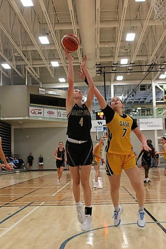 Lilly Vande Graaf of Manitoba's 17U provincial girls basketball team shoots over Saskatchewan's Ryan Zimmer. Manitoba took the cup, winning seven of the eight games. (Thomas Friesen/The Brandon Sun)