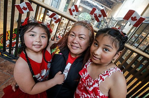 JOHN WOODS / FREE PRESS
Sarah Cotton with daughters Sweet Bella and Honey Victoria take in the Canada Day celebrations at the Forks Monday, July 1, 2024. 

Reporter: ?