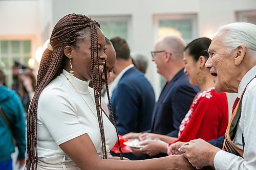 BROOK JONES / FREE PRESS
A CanadIan citizenship ceremony was hosted on Canada Day at the Pavilion at Assiniboine Park in Winnipeg, Man., Monday, July 1, 2024. Pictured: Oreo Amogu, 31, (left) smiles as she shakes hands with Elder Winston Wuttunee after she took the oath of citizenship. Amogu and her husband Henry Amogu, who also took the oath of citizenship, immigrated from Nigeria to Canada.