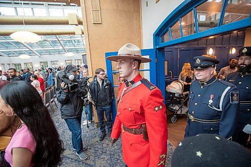 BROOK JONES / FREE PRESS
A CanadIan citizenship ceremony was hosted on Canada Day at the Pavilion at Assiniboine Park in Winnipeg, Man., Monday, July 1, 2024. A member of the RCMP and members of Canada Border Services Agency are pictured entering the Pavilion Atrium prior to the start of the citizenship ceremony.