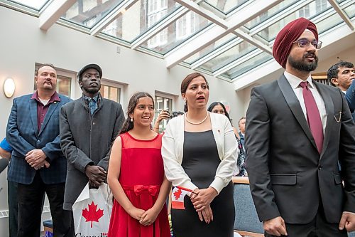 BROOK JONES / FREE PRESS
A CanadIan citizenship ceremony was hosted on Canada Day at the Pavilion at Assiniboine Park in Winnipeg, Man., Monday, July 1, 2024. Pictured: Gurpreet Singh (right), 28, is stands next to fellow new citizens of Canada as they sing O Canada during the Canadian citizenship ceremony.