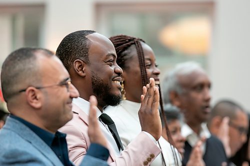 BROOK JONES / FREE PRESS
A CanadIan citizenship ceremony was hosted on Canada Day at the Pavilion at Assiniboine Park in Winnipeg, Man., Monday, July 1, 2024. Pictured: Henry Amogu, 31, (centre) smiles as he participates in the oath of Citizenship with his wife Oreo Amogu, 31, (right). The couple immigrated from Nigeria to Canada.