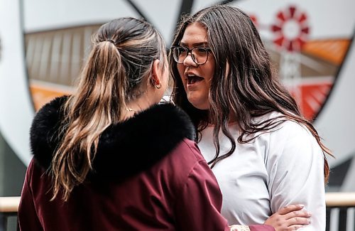 JOHN WOODS / FREE PRESS
Caramello Swan, right, and sister Chasity take in the throat singing demonstration at the Canada Day celebrations at the Forks Monday, July 1, 2024. 

Reporter: ?